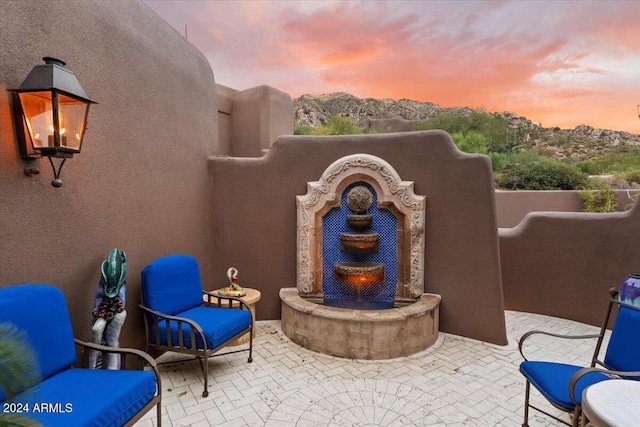 view of patio terrace at dusk