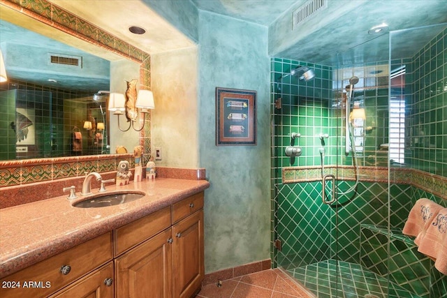 bathroom with vanity, tile patterned floors, and a shower with door