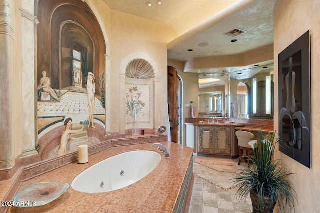 bathroom featuring vanity and a washtub