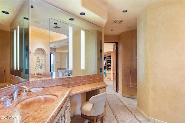 bathroom with vanity and tile patterned flooring