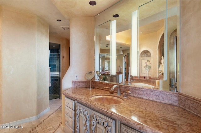 bathroom with vanity and tile patterned flooring