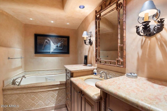 bathroom with vanity and a bath