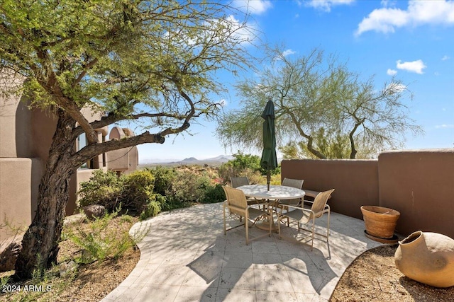 view of patio / terrace featuring a mountain view