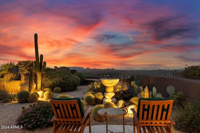 view of patio terrace at dusk