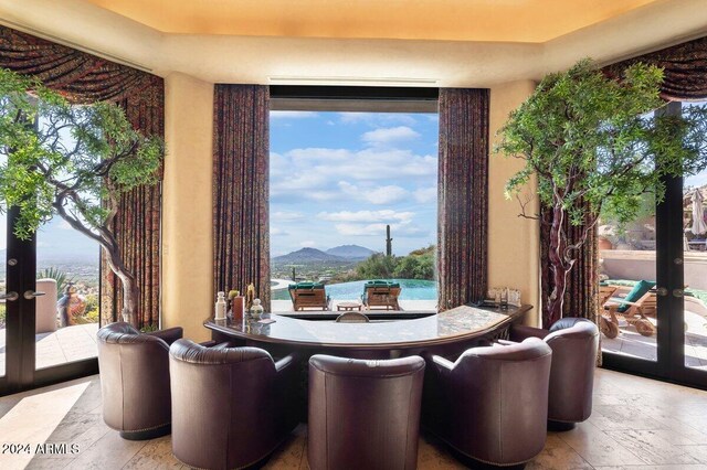 dining area featuring a mountain view and light hardwood / wood-style floors