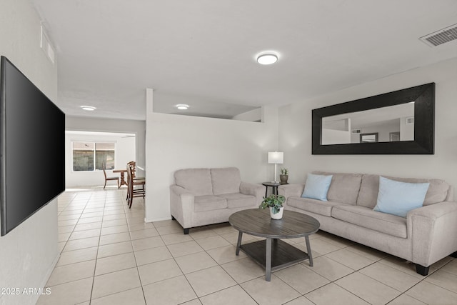 living room with light tile patterned floors