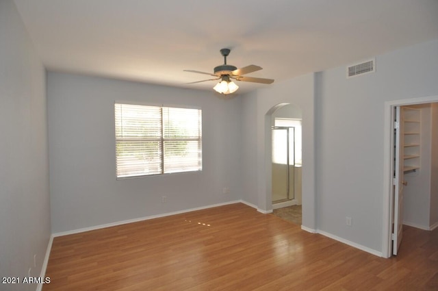 spare room with light hardwood / wood-style floors and ceiling fan