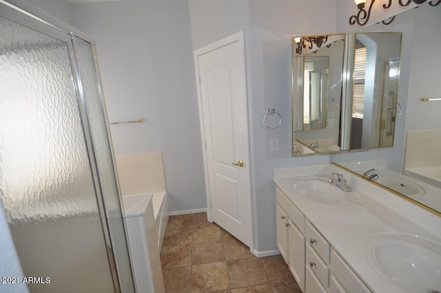 18071 W Douglas Way, Surprise, AZ 85374 - bathroom featuring a bath, double vanity, a shower stall, and baseboards
