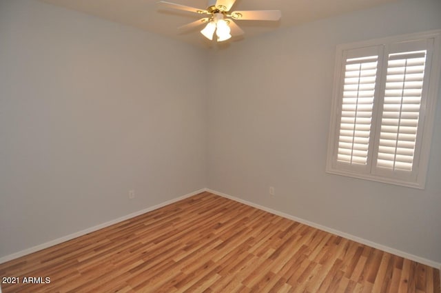 unfurnished room with light hardwood / wood-style floors, a healthy amount of sunlight, and ceiling fan