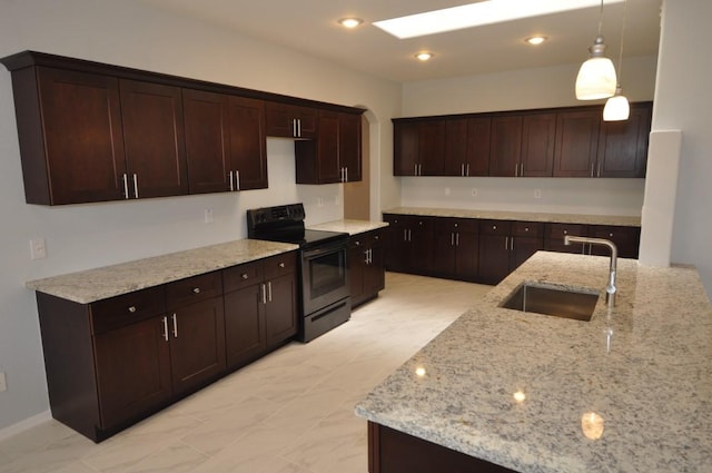 kitchen featuring black range with electric cooktop, dark brown cabinetry, hanging light fixtures, and sink