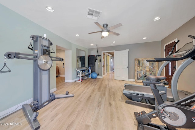 workout area featuring light hardwood / wood-style floors and ceiling fan