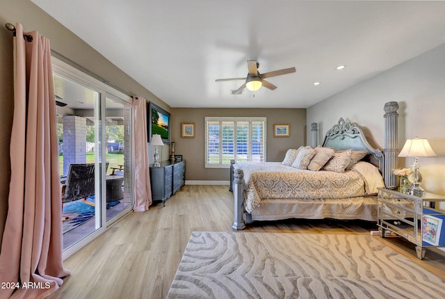 bedroom featuring ceiling fan, light hardwood / wood-style floors, and access to exterior