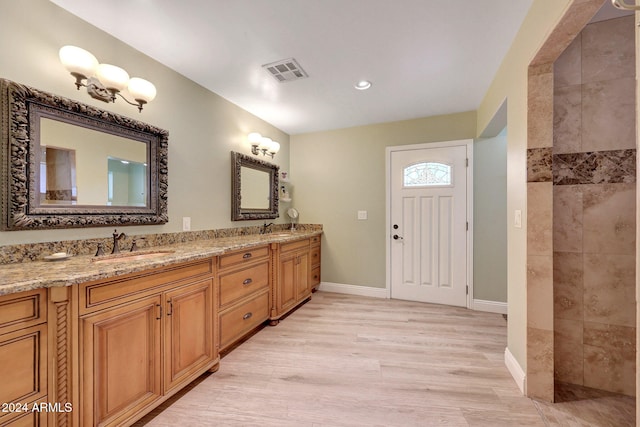 bathroom with wood-type flooring and vanity