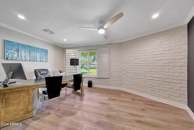 home office with light hardwood / wood-style flooring, brick wall, ceiling fan, and crown molding