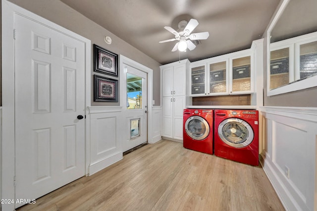 laundry room featuring cabinets, ceiling fan, light wood-type flooring, and independent washer and dryer