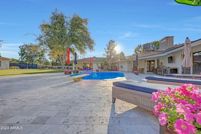 view of pool featuring a patio