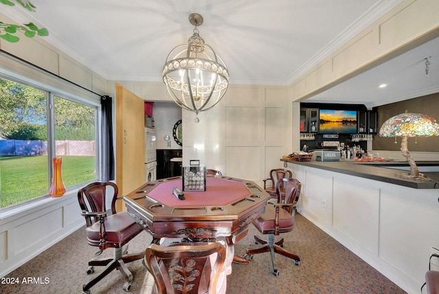 dining area featuring a chandelier and crown molding