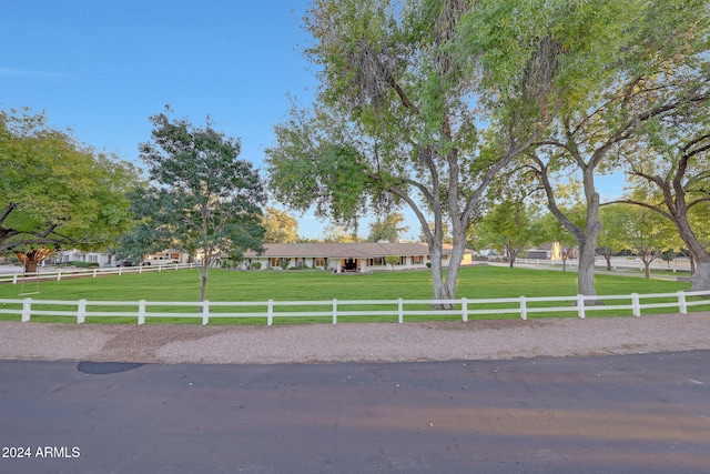 view of front of property featuring a rural view and a front yard