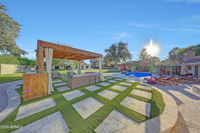 view of home's community with a pergola, outdoor lounge area, a patio, a lawn, and a pool