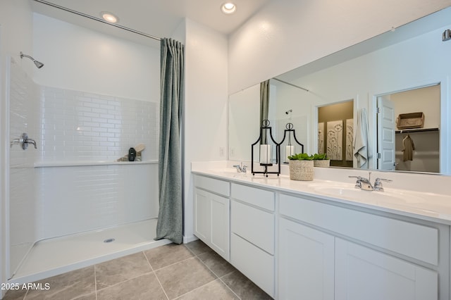 bathroom with tile patterned flooring, vanity, and a shower with curtain