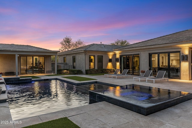 26099 N 88th Way, Scottsdale, AZ 85255 - pool at dusk with a patio area, an in ground hot tub, and an outdoor pool