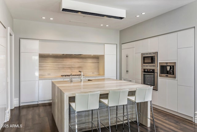 26099 N 88th Way, Scottsdale, AZ 85255 - kitchen featuring modern cabinets, dark wood-style flooring, stainless steel appliances, and light countertops