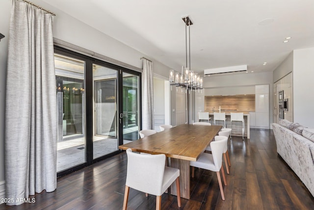 26099 N 88th Way, Scottsdale, AZ 85255 - dining space featuring dark wood-type flooring, an AC wall unit, recessed lighting, and a notable chandelier