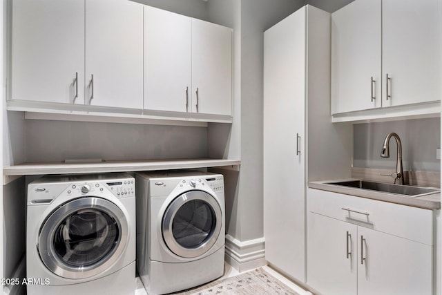 26099 N 88th Way, Scottsdale, AZ 85255 - laundry room with baseboards, washer and dryer, cabinet space, and a sink
