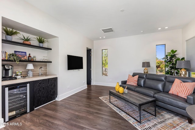 26099 N 88th Way, Scottsdale, AZ 85255 - living room featuring wet bar, beverage cooler, a wealth of natural light, and dark wood-style floors