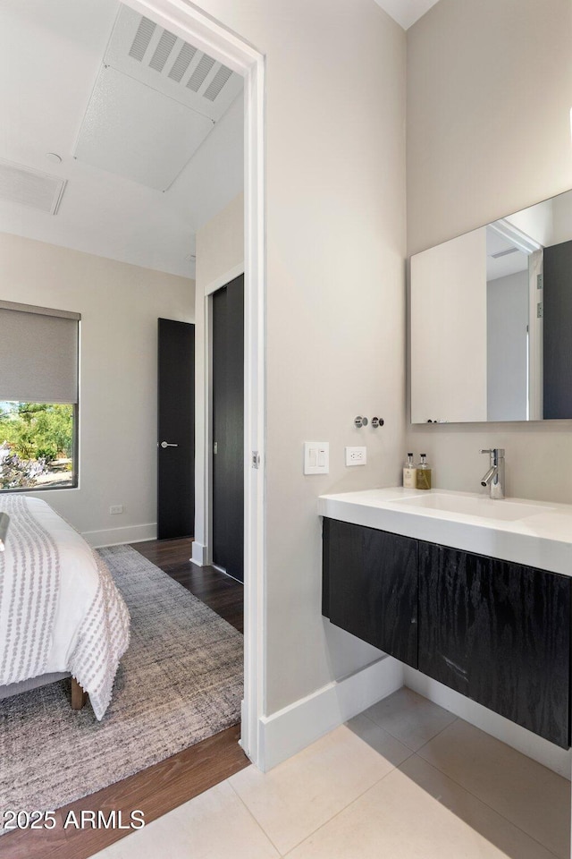26099 N 88th Way, Scottsdale, AZ 85255 - bathroom featuring wood finished floors, vanity, and baseboards