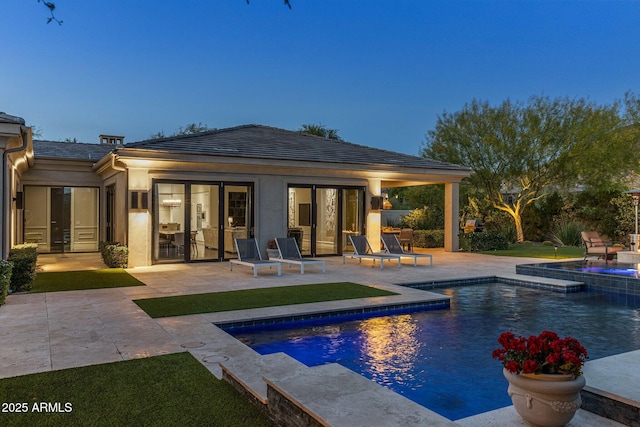 26099 N 88th Way, Scottsdale, AZ 85255 - rear view of house with stucco siding, an outdoor pool, a patio area, and an in ground hot tub