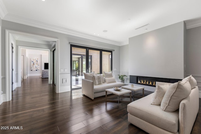 26099 N 88th Way, Scottsdale, AZ 85255 - living room with recessed lighting, a glass covered fireplace, dark wood-type flooring, baseboards, and ornamental molding