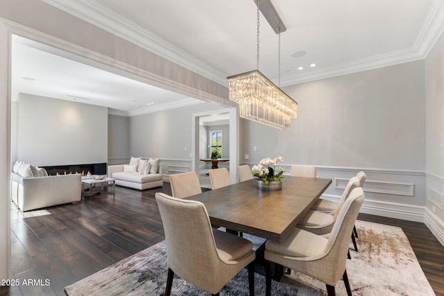 26099 N 88th Way, Scottsdale, AZ 85255 - dining space featuring crown molding, recessed lighting, an inviting chandelier, and dark wood-style flooring