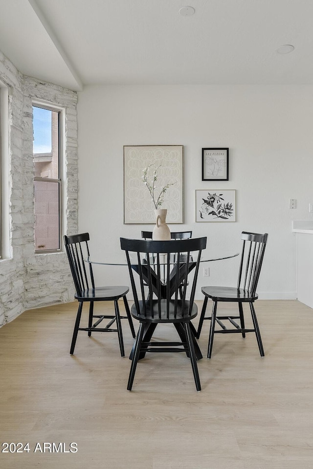 dining space with light hardwood / wood-style floors