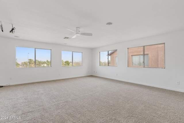 carpeted empty room with ceiling fan