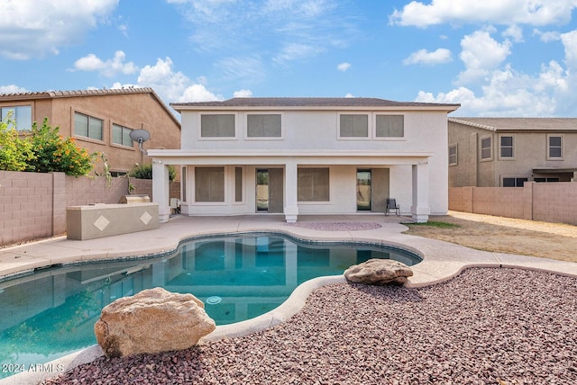 view of swimming pool featuring a patio area