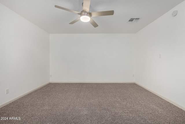 spare room with ceiling fan and carpet flooring