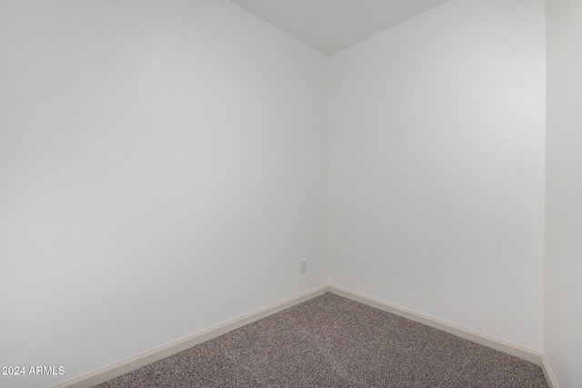 empty room featuring carpet flooring