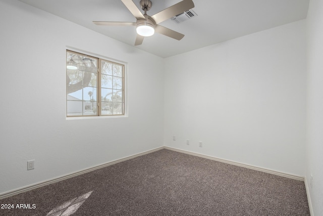 spare room featuring carpet floors and ceiling fan