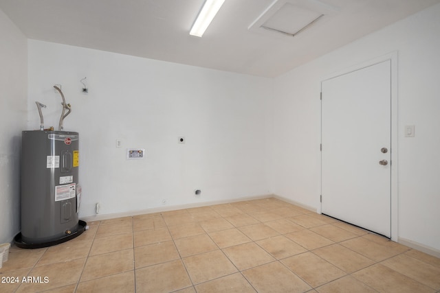 interior space with water heater and light tile patterned floors