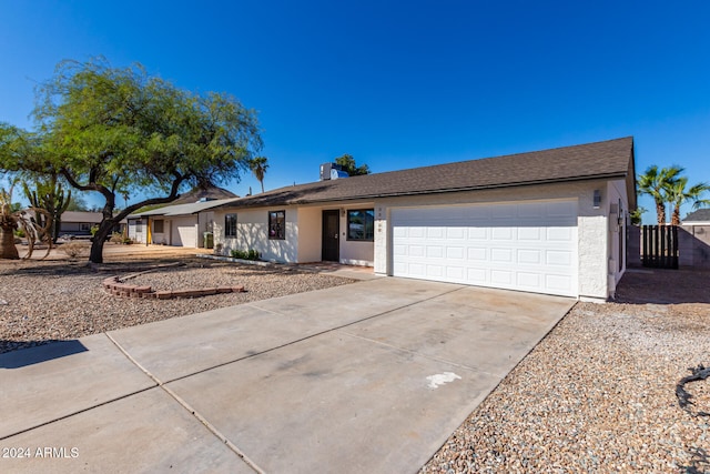 single story home with a garage