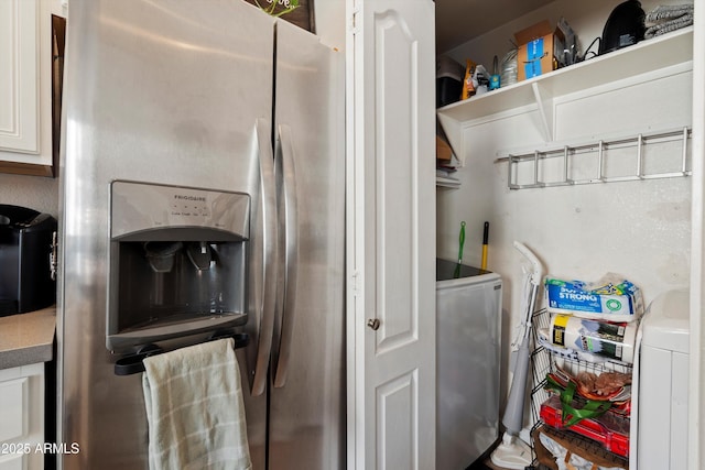 washroom with washing machine and clothes dryer