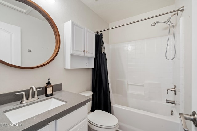 full bathroom with vanity, shower / tub combo, and toilet