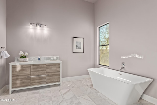 bathroom with vanity and a tub to relax in