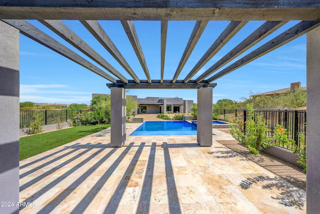 view of pool with a pergola and a patio area