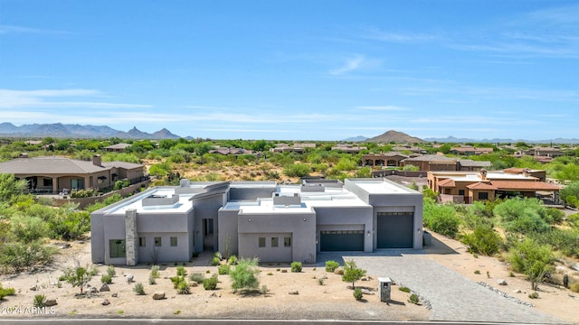 view of front of house with a mountain view and a garage