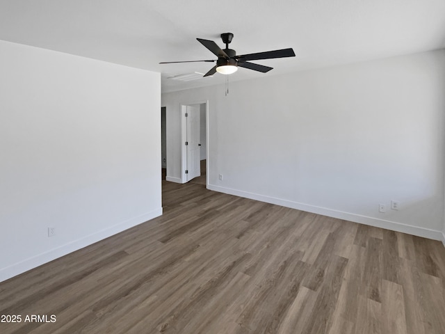 5308 N 77th Dr, Glendale, AZ 85303 - spare room with wood finished floors, a ceiling fan, and baseboards