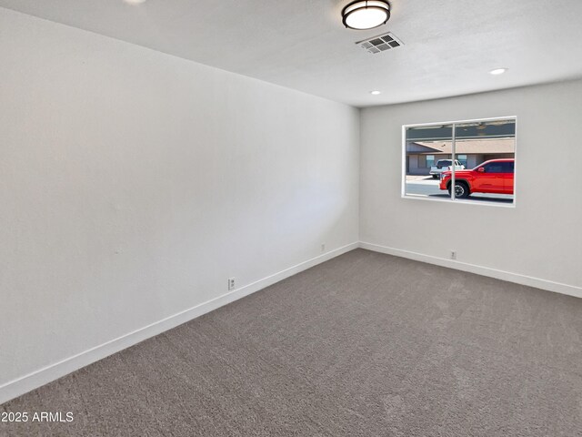 5308 N 77th Dr, Glendale, AZ 85303 - carpeted spare room with baseboards, visible vents, and recessed lighting