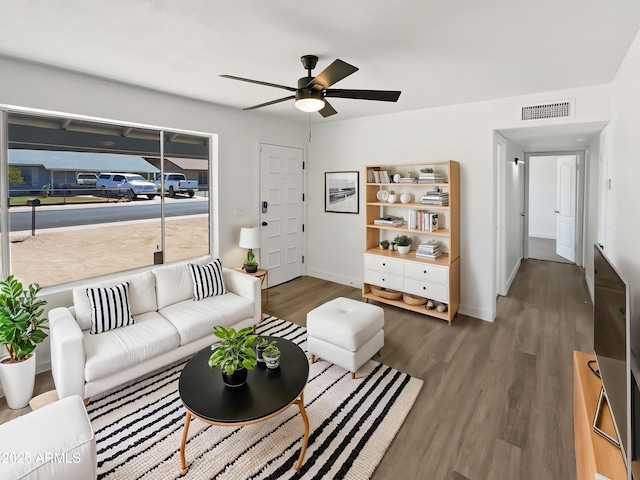 5308 N 77th Dr, Glendale, AZ 85303 - living room with baseboards, wood finished floors, visible vents, and ceiling fan