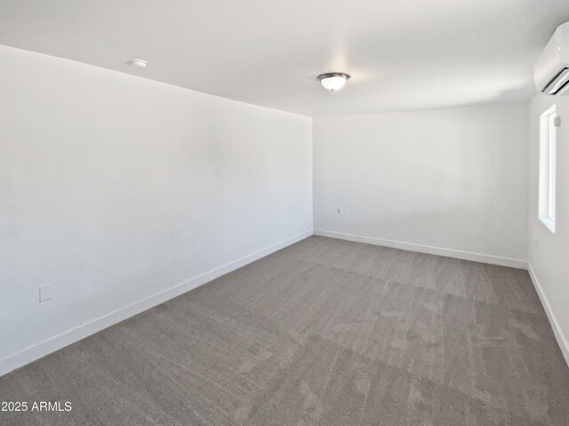 5308 N 77th Dr, Glendale, AZ 85303 - carpeted empty room featuring baseboards and a wall unit AC